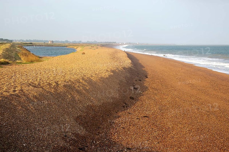 North Sea coastline view of shingle ridge and lagoon on beach bar, Shingle Street, East Lane, Bawdsey, Suffolk, England, UK