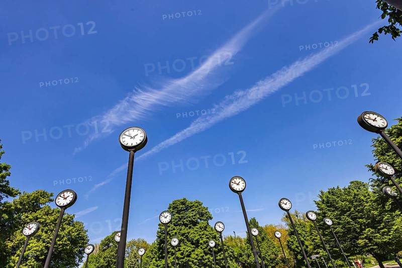 Time Field artwork, 24 synchronised station clocks in the Volksgarten show the time. Artist Klaus Rinke. City view of Düsseldorf, North Rhine-Westphalia, Germany