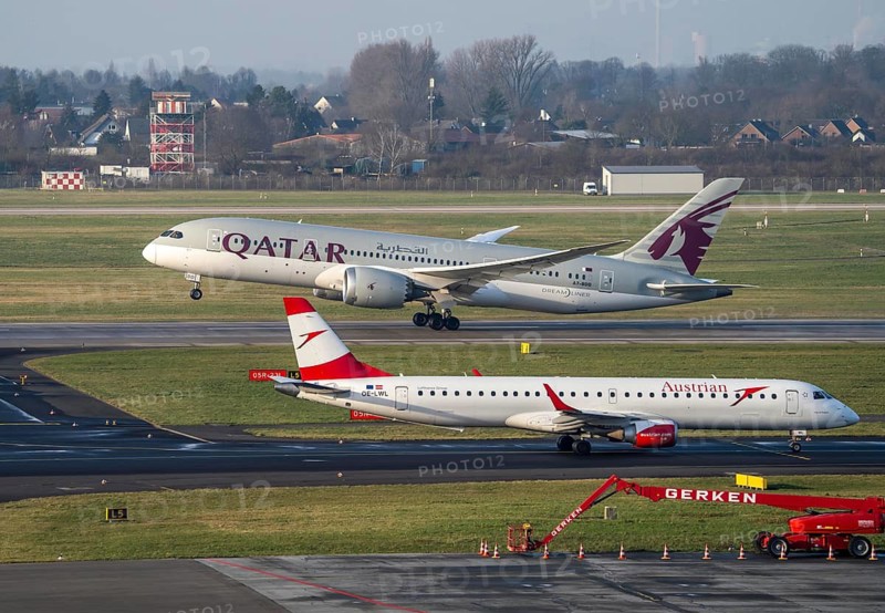 Düsseldorf Airport, Austrian aircraft on the taxiway and Qatar Airways Boeing 787 Dreamliner, on take-off, North Rhine-Westphalia, Germany