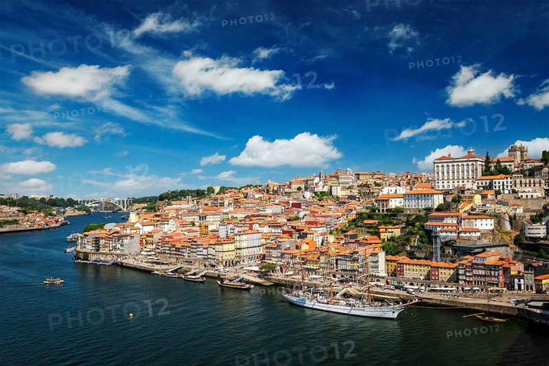 Aerial view of Porto city and Douro river with moored sailling ship from Dom Luis bridge I. Porto, Portugal