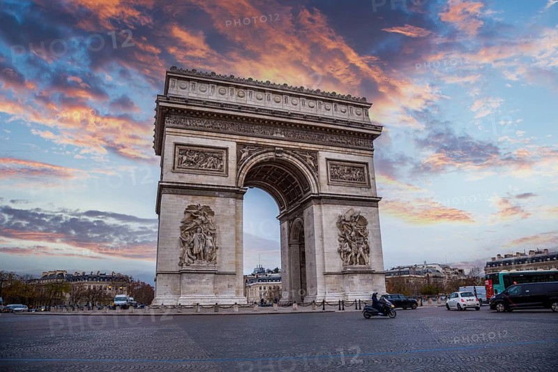 A beautiful sunset in the city of love at the Arc de Triomphe, Paris. France