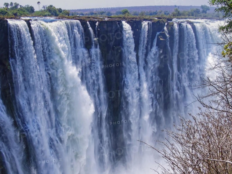 The Victoria Falls, Victoria Falls, a wide waterfall of the Zambezi River on the border of Zambia and Zimbabwe, is a UNESCO World Heritage Site. Victoria Falls, Zimbabwe
