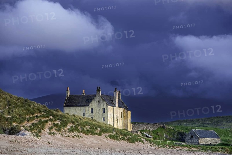 Dark rain clouds rolling in over Balnakeil House, 18th century mansion near Durness, Sutherland, Scottish Highlands, Scotland, United Kingdom