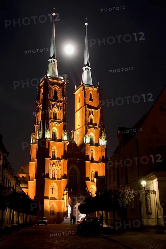 St. John the Baptist Cathedral at night, moon between the church towers in Wroclaw, Poland