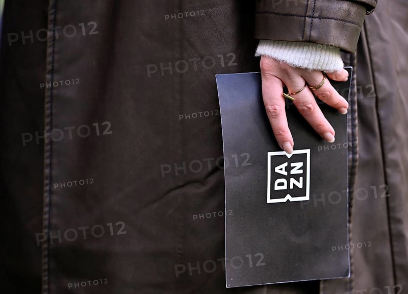 Close-up, hand of DAZN presenter reporter Lisa Tellers holding presentation card logo soccer Bundesliga, Voith-Arena, Heidenheim, Baden-Württemberg, Germany