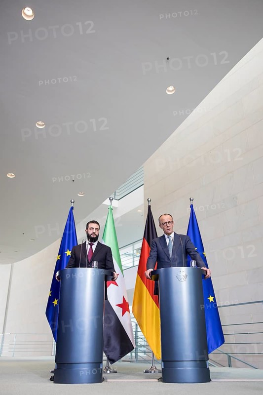 Ahmed al-Sharaa (President of the Syrian Arab Republic) and Friedrich Merz (Chancellor of the Federal Republic of Germany, CDU) at a press conference after a one-on-one meeting at the Federal Chancellery, Berlin, 30 March 2026