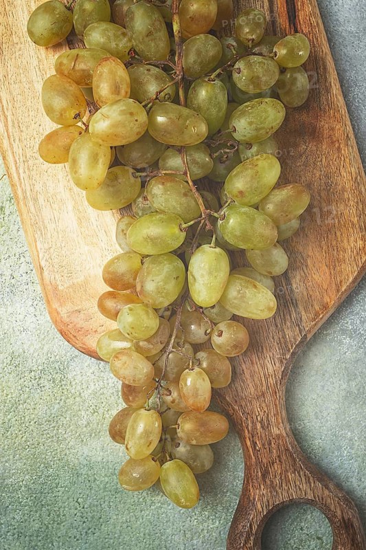 A branch of white grapes, wine grapes, Georgian grape variety Rkatsiteli, top view