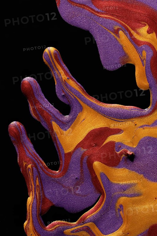 An artistic image of vibrant metallic paints swirling in deep purples, fiery oranges, and yellows against a stark black background
