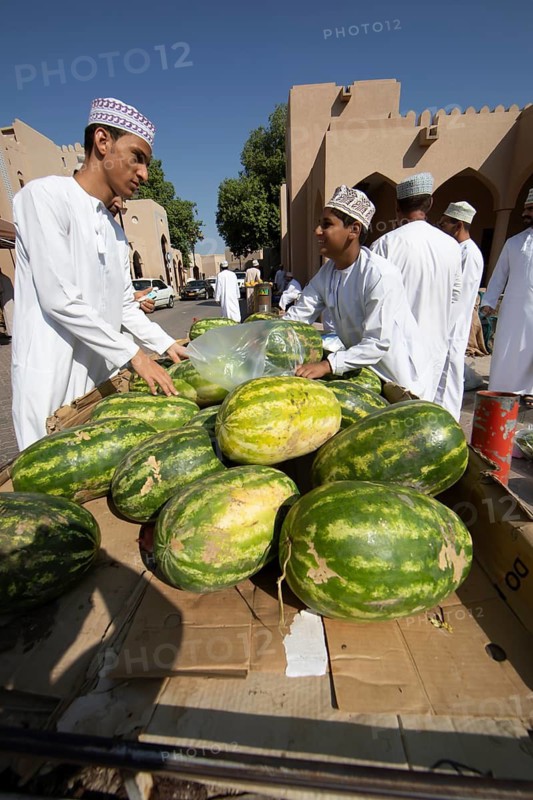 Watermelons for sale in the souk or soug or market in the old town of Nizwa, ad-Dachiliyya region, Oman