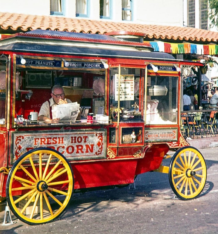 Cretors Model C or Model D popcorn wagon selling fresh hot popcorn in street, USA 1976