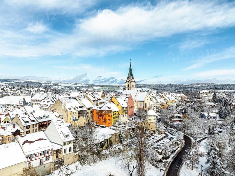Aerial view of the snow-covered town of Engen in Hegau on a winter morning with the Church of the Assumption of the Virgin Mary in the old town centre, Constance district, Baden-Württemberg, Germany