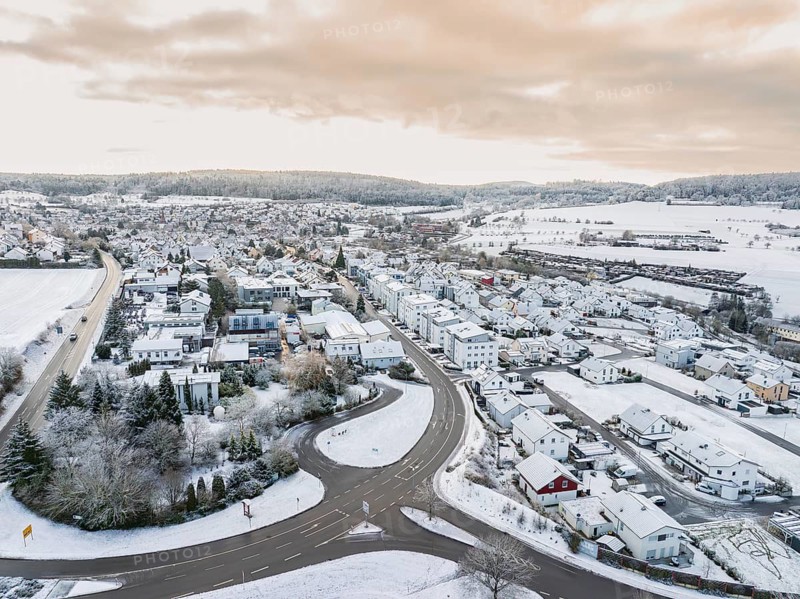 Winter landscape of a village with streets and structure in the snow, Calw- Stammheim, Black Forest, Germany