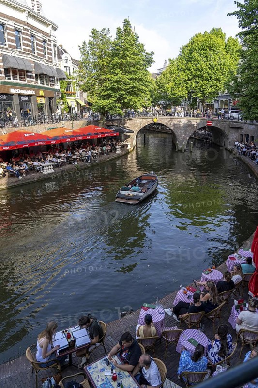 The old town centre of Utrecht, Oudegracht, around 2 km long with many old houses, shops, restaurants directly on the canal, many bridges, boat traffic of all kinds, Netherlands