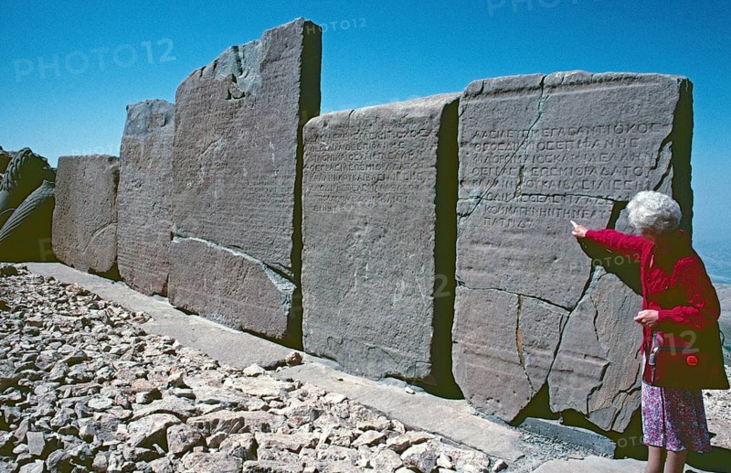 Tourist, labelled back of the relief panels, western terrace, Mount Nemrut Dagi, Taurus Mountains, Adiyaman Province, Southeast Anatolia, Turkey, May 1987, vintage, retro, old, historical