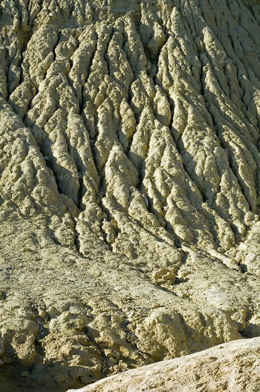 Gullies in soft rock of cliff caused by rain water erosion