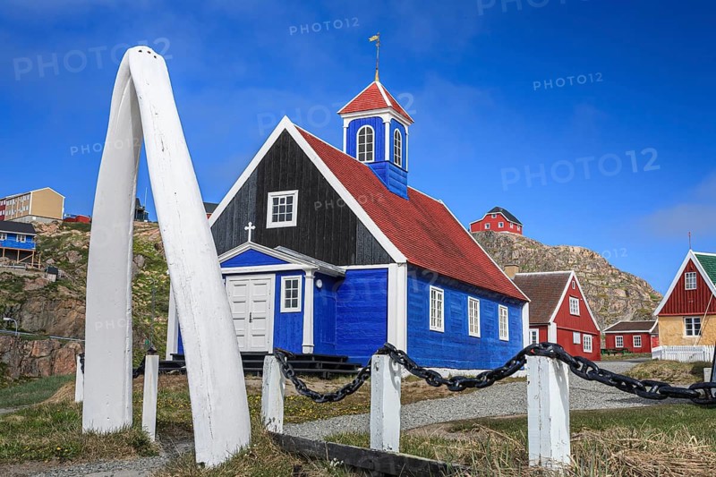 Historical building and whale bones in front of a blue sky, Museum, Sisimiut, West Greenland, Greenland