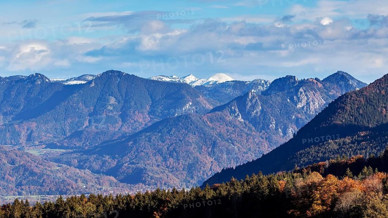 Mountain panorama with snow-covered peaks and autumnal forest in the Alps, Hocheck