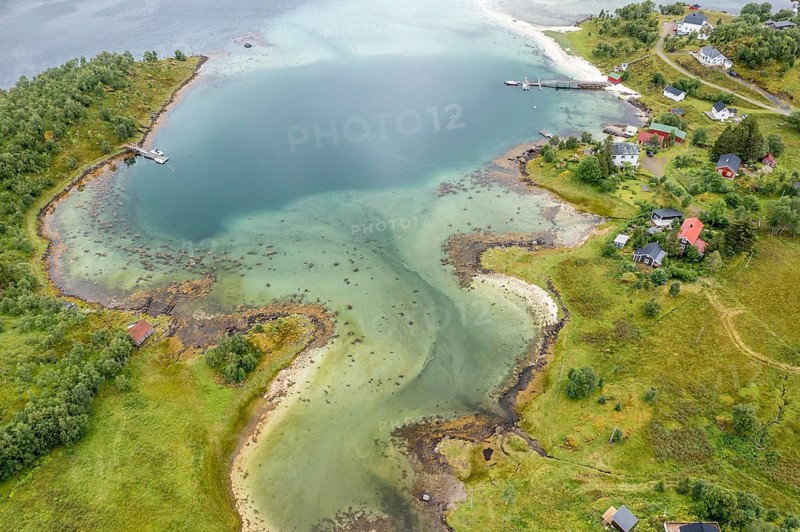 Aerial view of a bay at the Raftsund, single hut with boat, fjord between Lofoten and Vesteralen, Norway