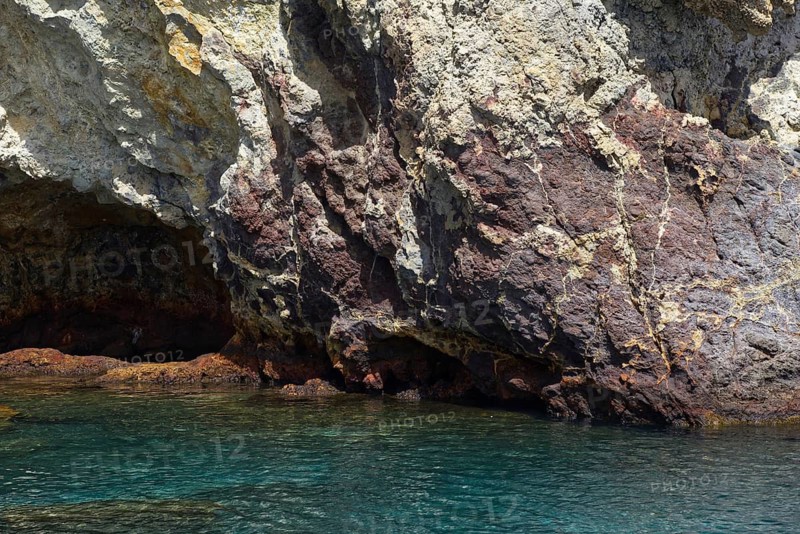 A rocky coast with impressive rocks and crystal clear water, Vulcano Lipari Islands, Sicily Italy
