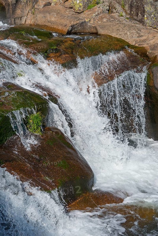 A detailed waterfall flows over moss-covered rocks in a stony landscape, Cascada del Diablo, Devil's Waterfall, Garganta de Gualtaminos, Gualtaminos Gorge, La Vera, Cáceres, Caceres, Extremadura, Spain