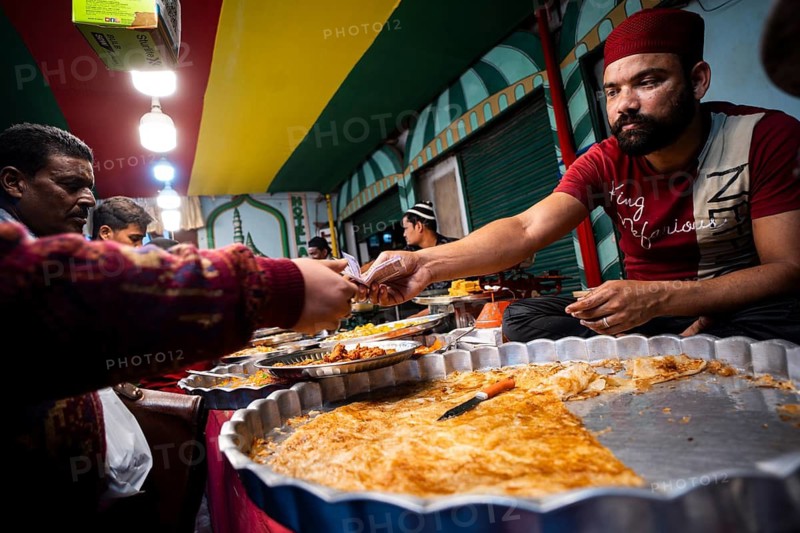 Muslims buy food at a stall to have Ramadan's Iftar during Muslim holy month of Ramadan in Guwahati, India on March 5, 2025