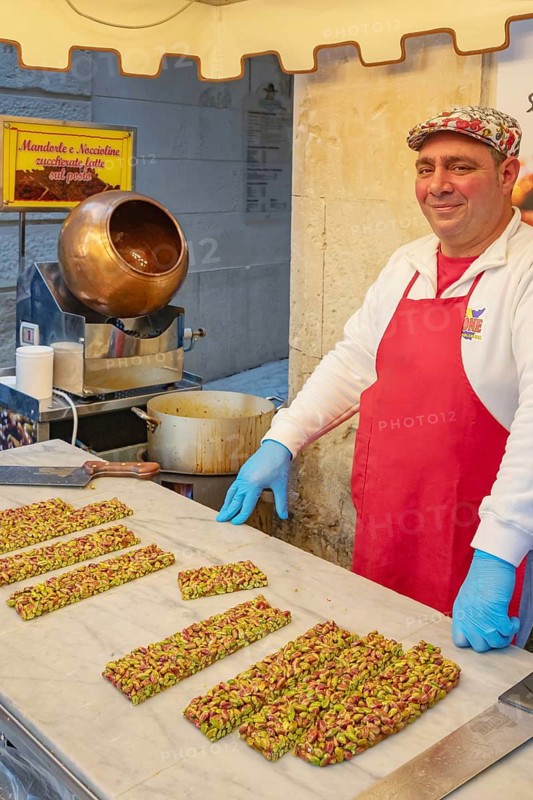 Person making traditional nougat, Ortygia, Syracuse, Sicily, Italy