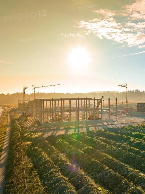 Aerial view during the construction of the Lindenrain industrial park with fog at sunrise Black Forest, Calw, Germany