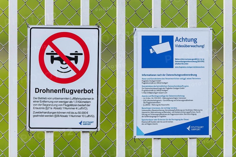 Signs on an airport barrier fence, video surveillance, drone flight ban, Stuttgart, Baden-Württemberg, Germany
