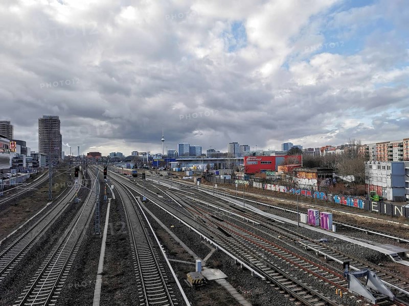 Extensive railway area with city views and cloudy skies, Berlin