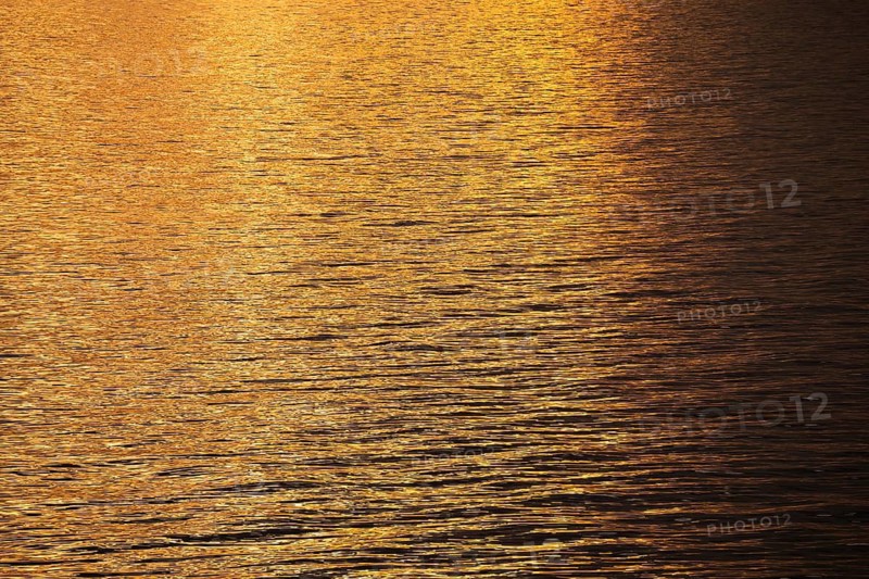 Sun rays are reflected on the sea surface, small waves, Baltic Sea