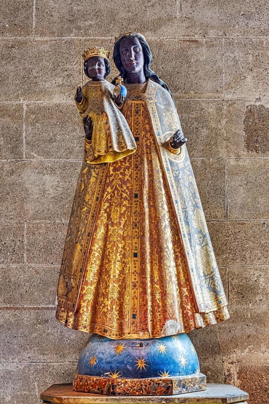 Holy Madonna and Child in a splendid gold and blue robe on a plinth, Le Mont-Saint-Michel
