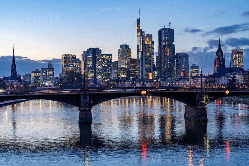 Skyline of the city centre of Frankfurt am Main, river Main, dusk, Ignatz-Bubis-Brücke, Hesse, Germany