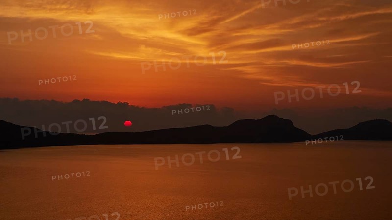 A dramatic red sunset, the landscape appears in backlight, Navarino Bay, Pylos, Peloponnese, Greece