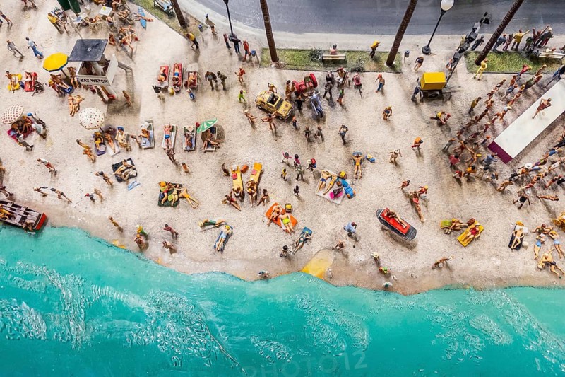 Tourists in summer on the beach as a representation with miniature figures, holiday, beach holiday, summer, summer holiday