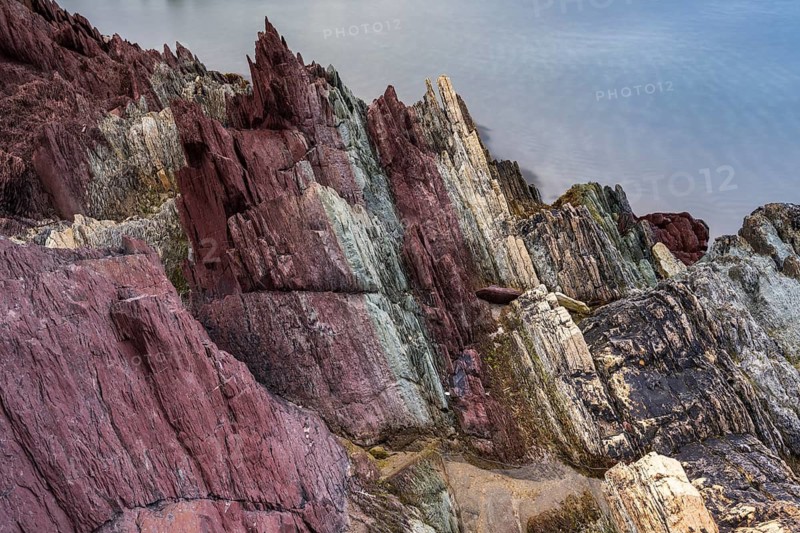 Colourful rocks on the coast, Varanger, Barents Sea, Finnmark, Norway