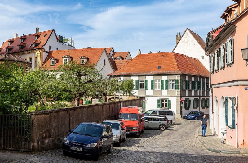 Small orchard between narrow houses, mountain town of Bamberg, Bavaria, Germany