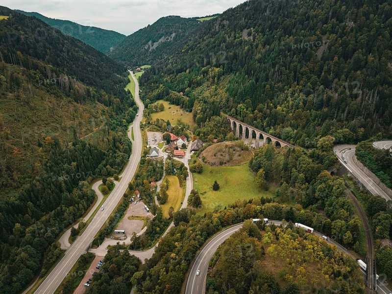 Aerial view of a valley with roads, a village and a railway bridge, surrounded by wooded mountains, Ravenna Gorge, Black Forest, Germany