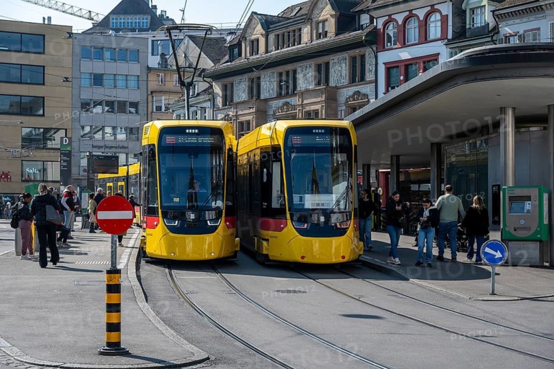 Two modern Stadler TINA trams on Barfüsserplatz in downtown Basel, operated by Baselland Transport AG, Canton of Basel-Stadt, Switzerland