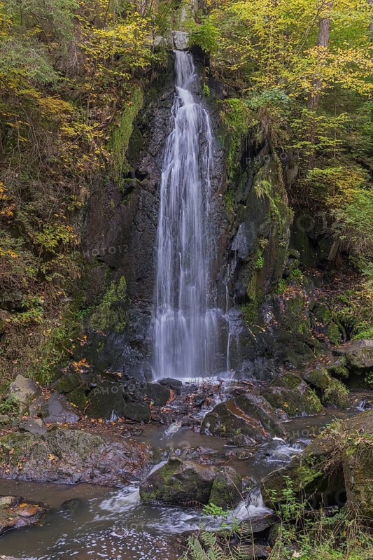 Waterfall in early autumn. Scenic park Terezino udolí (Tercino údolí or Tereziino) located in the valley of the river Strobnitz near the town of Nove Hrady in southern Czech Republic. Built in 1756