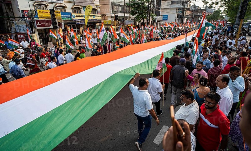 People holding Indian national flags as they take part in a rally, in soliderity with the Indian armed forces in Guwahati, India on 14 May 2025. A nationwide campaign Tiranga Yatra organized by the Bharatiya Janata Party (BJP) to honor the Indian armed forces' success in Operation Sindoor