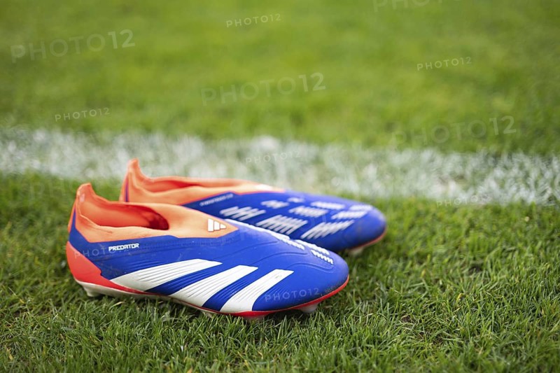 LUBIN, POLAND - MARCH 31, 2025: Football match between KGHM Zaglebie Lubin vs Rakow Czestochowa. Soccer boots nxt to the pitch line