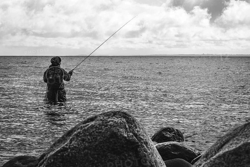 Anglers in the water on the Baltic Sea