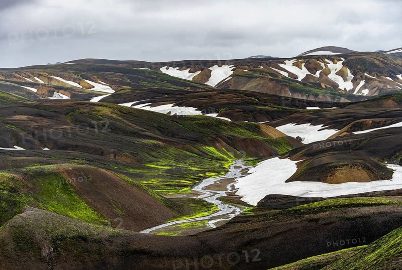 Colourful volcanic landscape with hills and snow, volcanic hot springs, Laugavegur trekking trail, Landmannalaugar, Fjallabak Nature Reserve, Icelandic Highlands, Suðurland, Iceland