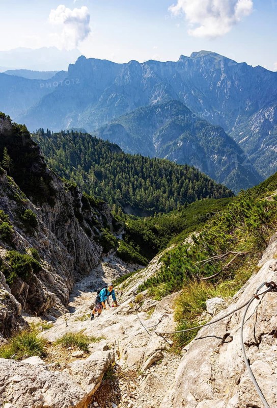 Hiker in a climbing passage on the way to the Rinnkogel, Postalm, Osterhorn group, Salzkammergut, Salzburg province, Austria