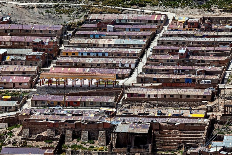Densely built townhouses with different colored roofs in an urban environment, The silver mines of Potosi on Cerro Rico in Bolivia