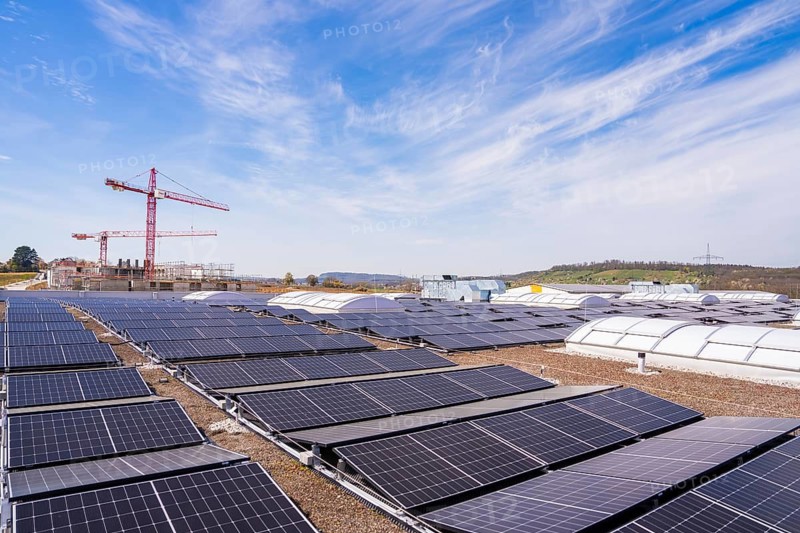 Construction and maintenance of solar systems under clear skies, progress in sustainable construction, PV installation. OBI Baumarkt, Mühlacker, Enzkreis, Germany