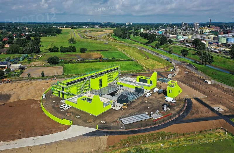 Oberhausen, North Rhine-Westphalia, Germany - Emscher conversion, new Emscher AKE sewer, here the new Oberhausen pumping station, Germany's largest wastewater pumping station, uses 10 pumps to pump up to 16, 500 litres of wastewater per second from a depth of around 40 metres. At the back, new floodplains for better flood protection. At the back right, OQ Chemicals plant Ruhrchemie. The ecological conversion of the Emscher system consists of the construction of a central wastewater treatment system in the Ruhr area, the construction of sewers and the renaturalisation of the Emscher and its tributaries