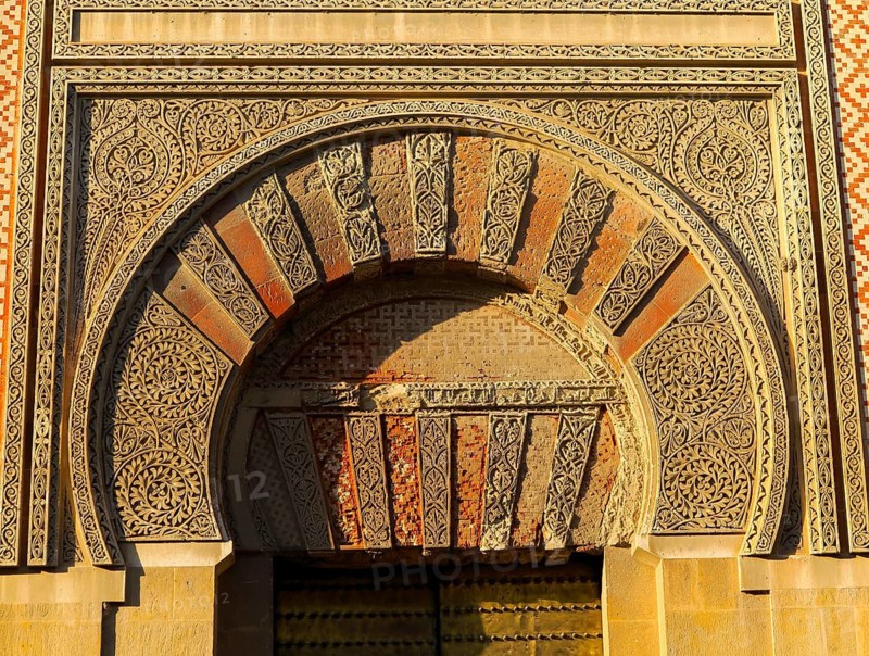Moorish doorway arch elaborately inscribed stonework of the mezquita Great Mosque, Cordoba, Spain