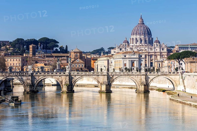 Rome skyline with St Peter's Basilica in the Vatican Ponte Sant'Angelo bridge over the river Tiber in Rome, Italy