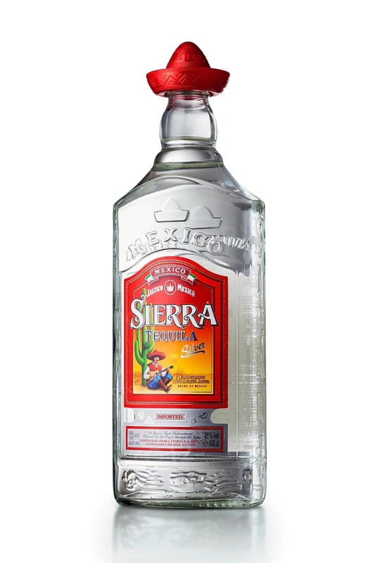 MINSK, BELARUS, OCTOBER 3, 2016: Bottle of Tequila Sierra Silver isolated on white background. Tequila is a regional specific name for a distilled beverage made from the blue agave plant in Mexico